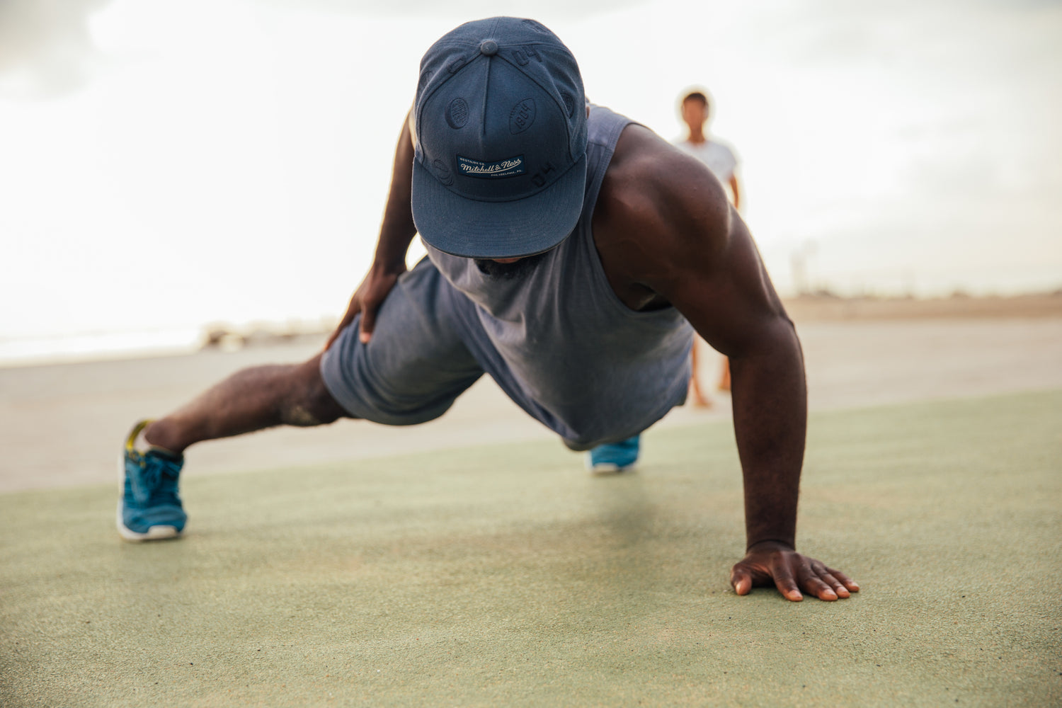 Man performing a one-hand push-up, symbolizing strength and mental empowerment, representing the journey to becoming unstoppable through mental training with Elite Footy Mentality and the MENTAL 2.0 blueprint.